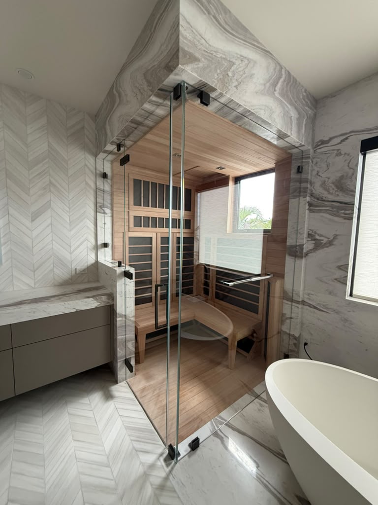 Custom glass enclosure beside a built-in sauna